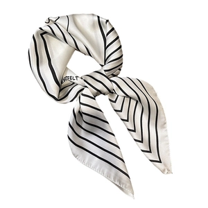 Elegant striped silk-like scarf for women in cream and black with HEARTFELT print