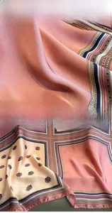 Detail of color-block paisley silk scarf showing active carbon dyeing and fine stitching