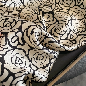 Classic black and white silk scarf with large camellia print and satin glossy finish