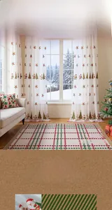 Detail showing Santa Claus and Christmas tree embroidery on white semi-sheer curtains