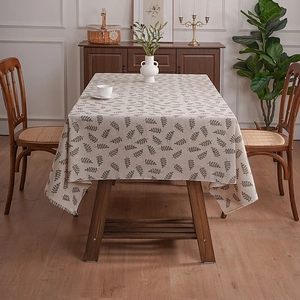 Elegant beige rectangular polyester tablecloth with green leaf patterns and tassels
