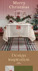 Close-up of festive Christmas tablecloth with red bell embroidery and lace wavy edges