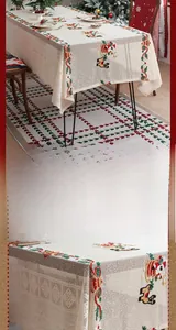 Detail display of lace tablecloth with Santa Claus and wreath holiday embroidery