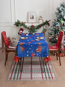 Close-up of American Christmas tablecloth and red chair covers with festive prints
