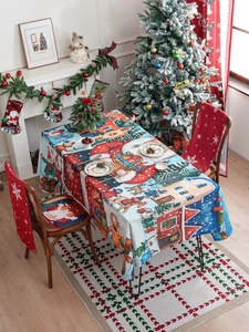 Detailed view of Christmas tablecloth with Santa Claus and reindeer festive patterns