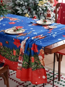 Detailed texture of waterproof Christmas tablecloth with festive santa and snowflake prints