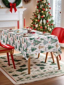 Christmas tablecloth featuring festive trees and red gift boxes on white fabric