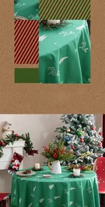 Detail of Christmas green tablecloth with white reindeer embroidery and festive scenery