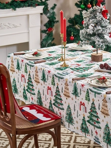 Detailed Christmas table runner and chair covers set with tree patterns and holiday motifs