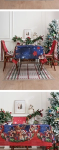 Detailed pattern of festive tablecloth featuring Nutcracker, Teddy Bear and Santa Claus