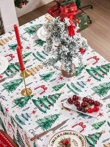 Close-up of waffle texture Christmas tablecloth with festive tree and star patterns