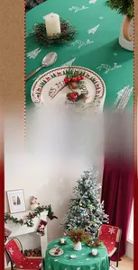 Detail of Christmas tablecloth with white reindeer embroidery and festive chair covers