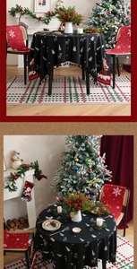 Detail view of black Christmas tablecloth with reindeer and snowflake embroidery patterns