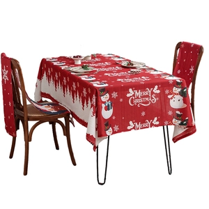 Christmas tablecloth set with chair covers featuring snowman and forest silhouette in red