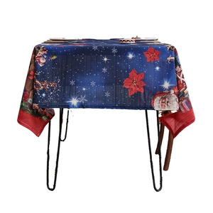 Christmas tablecloth with Santa Claus and poinsettia pattern on dark blue fabric