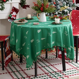 Round dark green Christmas tablecloth with white deer embroidery and tassel edges