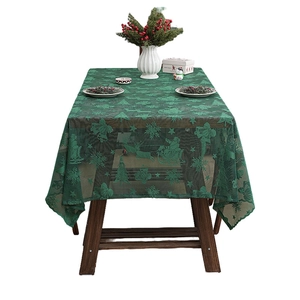 Green lace Christmas tablecloth with Santa, reindeer and snowflake festive patterns