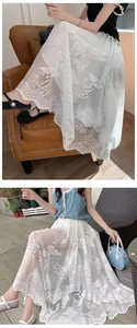 Detailed embroidery of white roses and butterflies on sweet lace mesh skirt fabric