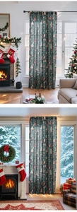 Detail of Christmas window curtains with festive trees and snowflakes in a cozy room