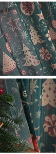 Detail of Christmas themed curtains featuring festive tree prints on dark green fabric