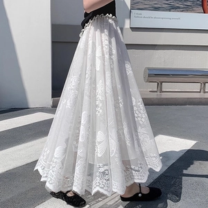 Elegant white high-waisted lace skirt featuring intricate floral and butterfly embroidery