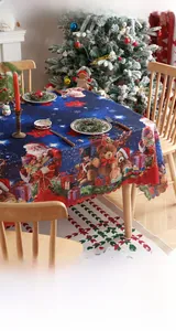 Festive navy blue Christmas tablecloth detail with nutcracker and Santa Claus patterns