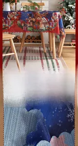 Detail of Christmas tablecloth with nutcracker print and elegant wavy scalloped edges