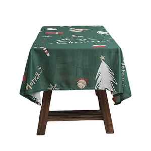 Dark green Christmas tablecloth with white Merry Christmas print and festive deer patterns