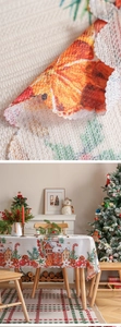 Detailed view of woven Christmas tablecloth with festive prints and zigzag edge finish