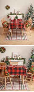 Detail of red and black plaid Christmas tablecloth set with floral and pine motifs