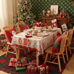 Christmas tablecloth with red edge and winter village pattern for holiday dining decor