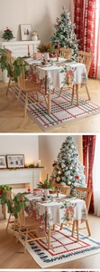 Close-up of vintage Christmas tablecloth with gingerbread house patterns and holly leaves
