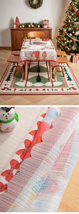Detail of Christmas tablecloth fabric texture with snow scene and wavy edge cut