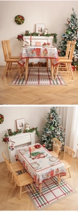 Detail of Christmas tablecloth and mat with Santa print and laser-cut scalloped edges