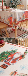 Detail of Christmas tablecloth with embossed festive patterns and red wavy hollow edges