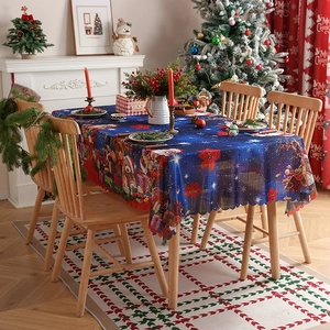 Christmas tablecloth with teddy bears and poinsettia pattern in festive home setting