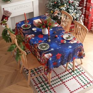 Navy blue Christmas tablecloth with Santa and reindeer prints for holiday dining decor
