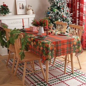 Christmas red plaid tablecloth with festive pine needles and gingerbread man patterns