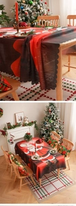 Detailed close-up of scalloped edges on a Christmas tablecloth with Santa Claus print