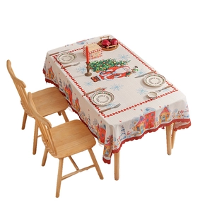 Rectangular Christmas tablecloth with festive prints and red ruffled edges for dining decor