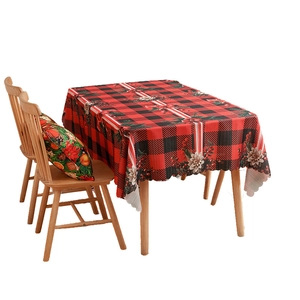 Christmas buffalo plaid tablecloth with festive floral patterns and berries on white backdrop