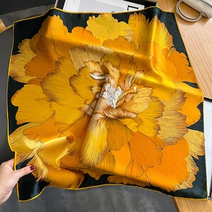 Luxurious large silk square scarf with vibrant orange peony floral print on black background