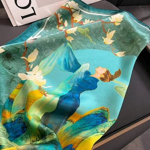 Detail of silk scarf featuring elegant magnolia flowers and traditional Chinese painting