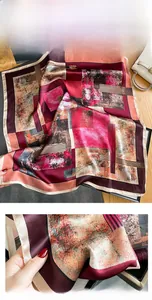 Close-up of premium silk scarf showing refined stitching and abstract oil painting print