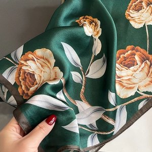 Elegant emerald silk scarf with yellow rose print and premium satin finish for women