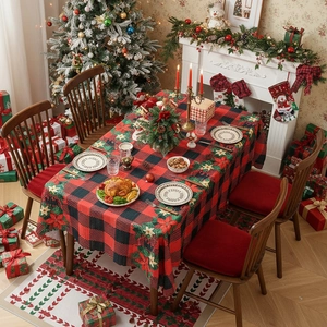 Red and black buffalo plaid Christmas tablecloth with poinsettia floral patterns