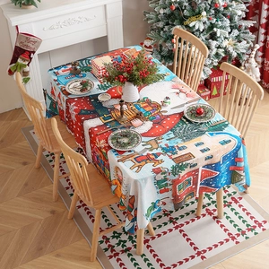 Christmas tablecloth with Santa and reindeer pattern in a festive dining room setup