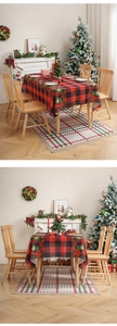 Detail of red and black plaid Christmas tablecloth with festive floral corner patterns
