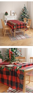 Macro view of Christmas plaid tablecloth with scalloped edges and festive floral patterns