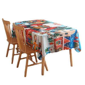 Festive Christmas tablecloth featuring Santa Claus and winter village scenery on white background